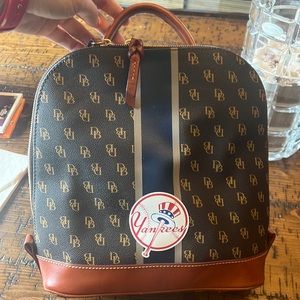 Backpack zip up style of Dooney and Bourke Sports collection. New York Yankees.